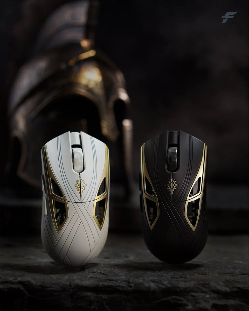 Finalmouse SLX Achilles in white (Son of Thetis) and black (Son of Peleus) in front of a Greek warrior helmet